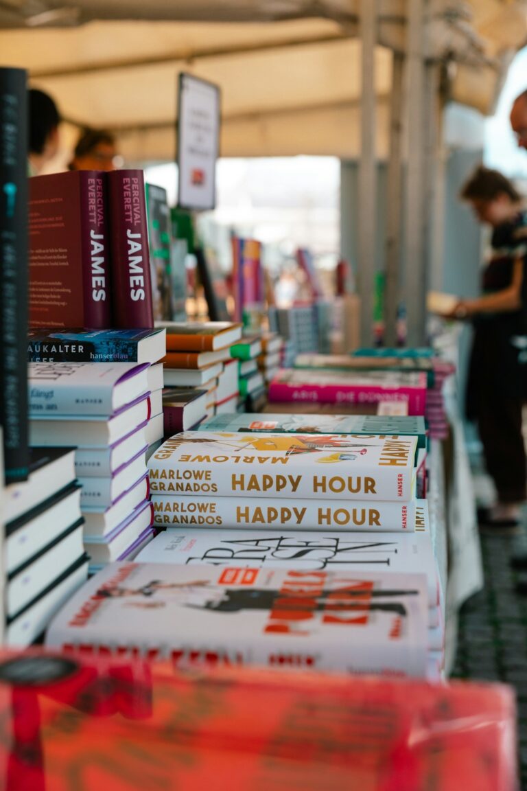 Books stacked on a table at a bookstore